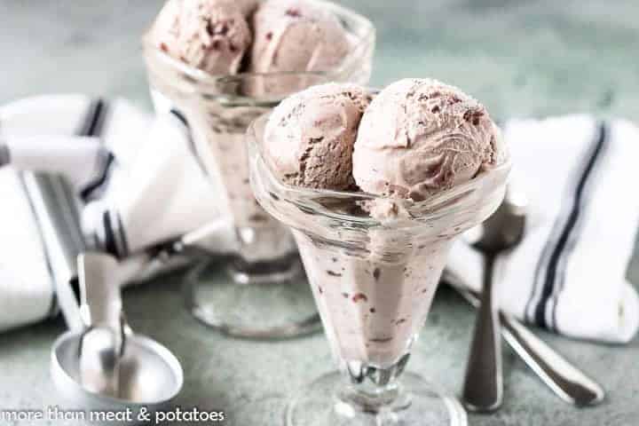 Two dishes filled with scoops of the cherry vanilla ice cream.
