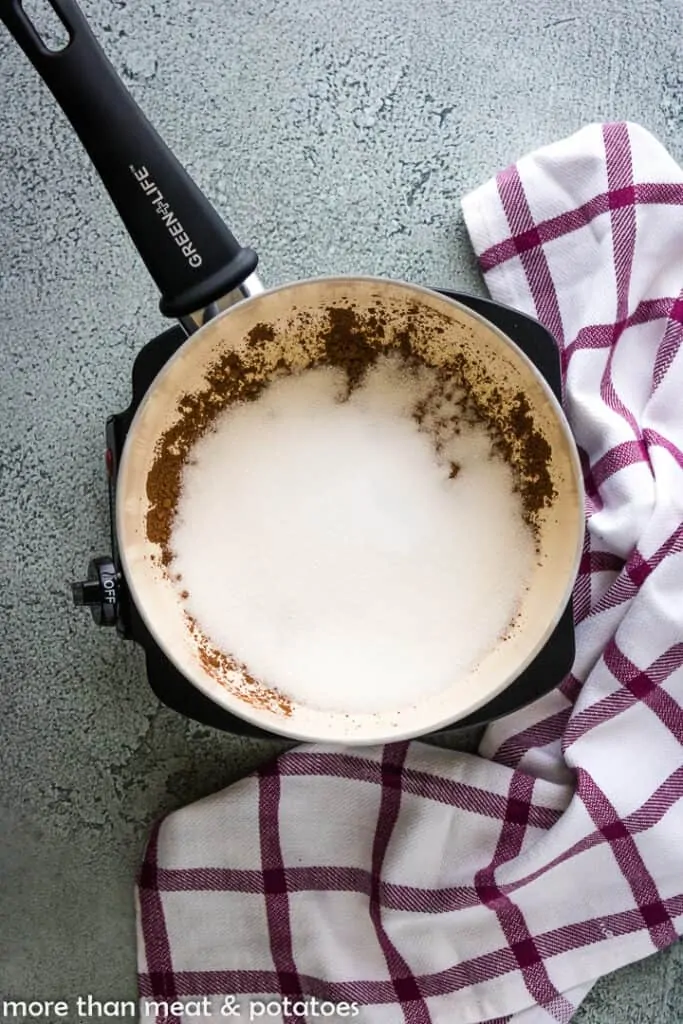 Cocoa, sugar, and other ingredients in a large saucepan.