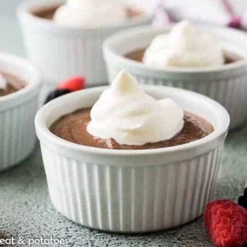 The chocolate pudding cup topped with Chantilly cream.