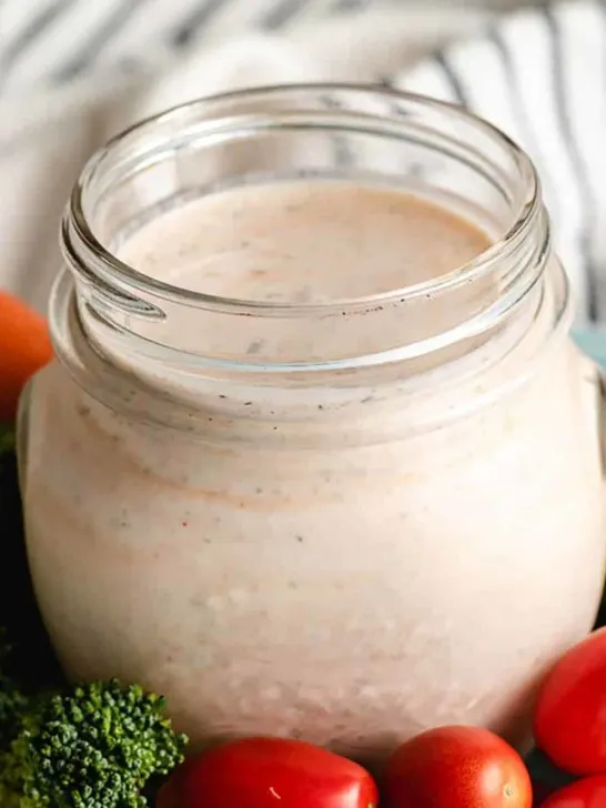 Homemade ranch dressing no mayo in a mason jar with veggies.
