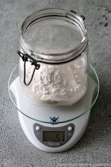 Flour on top of sourdough starter.