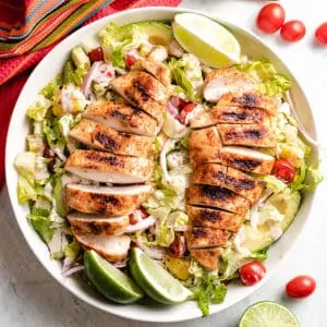 An aerial view of the grilled chicken salad in a bowl.