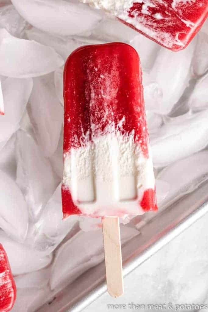A close-up of the popsicle showing the berries and cream.