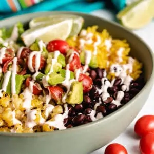 The finished vegetarian burrito bowl in a green dish.