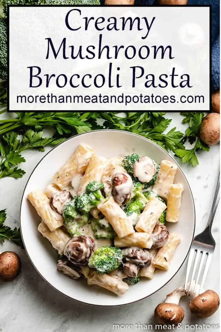 Plate of vegetable pasta next to fresh mushrooms.