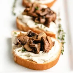 The finished mushroom toast on a rectangular plate.