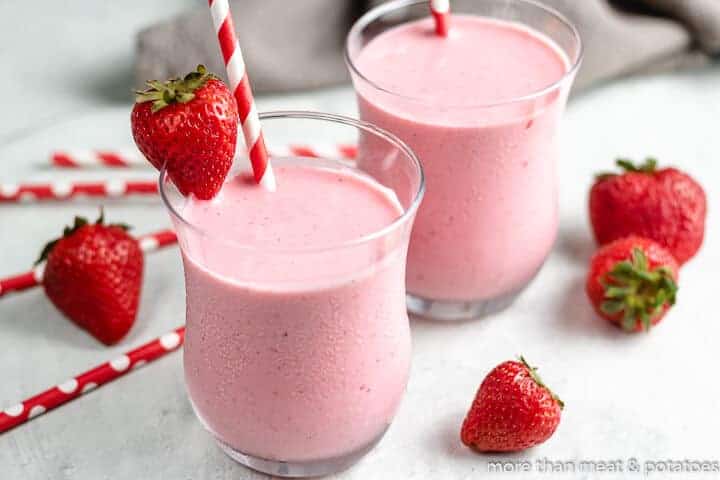 The strawberry Greek Yogurt smoothie served in two glasses.
