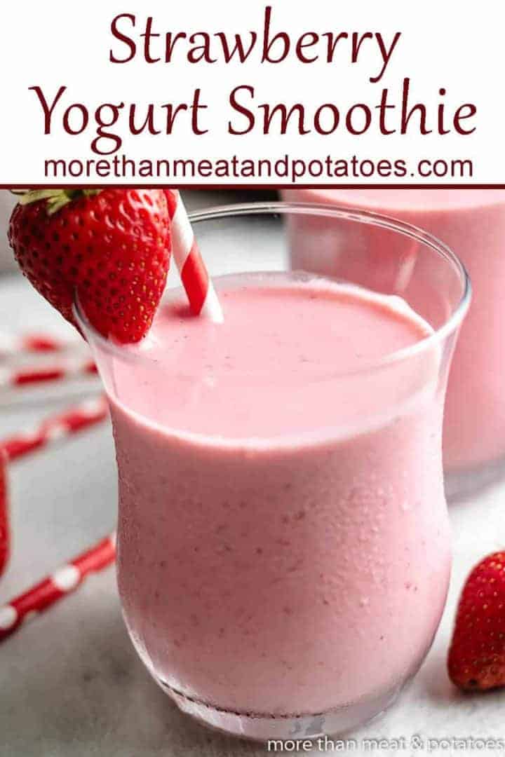 A strawberry Greek yogurt smoothie garnished with a fresh berry.