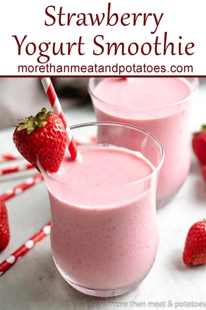 Two strawberry greek yogurt smoothies with colorful straws.