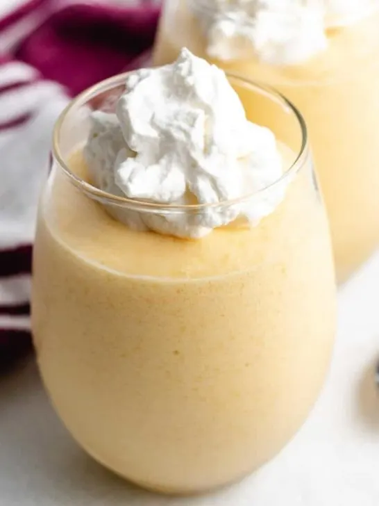 The finished mango mousse served in a glass.