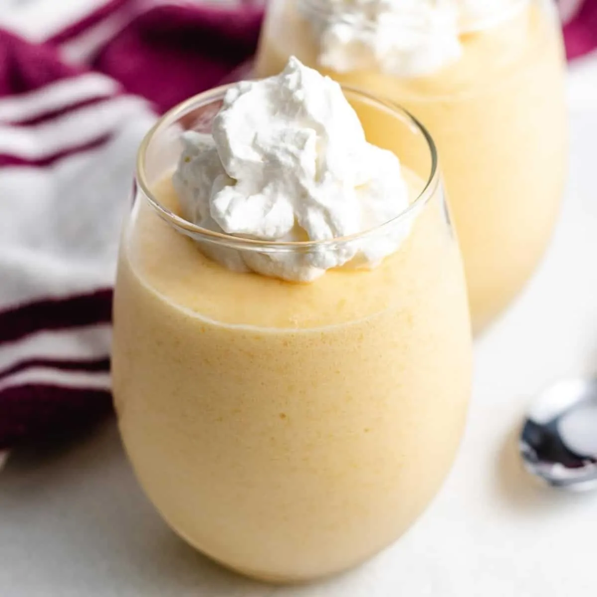 The finished mango mousse served in a glass.