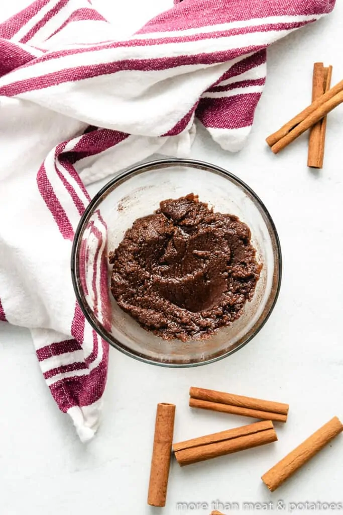 Melted butter, cinnamon, and sugar combined in a bowl.