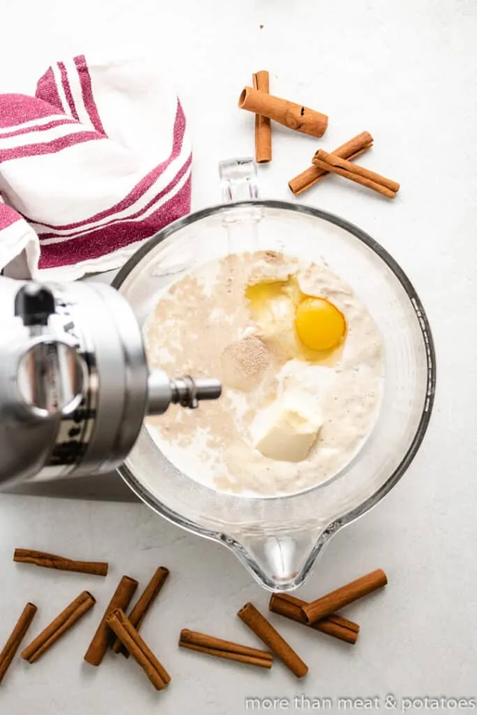 Eggs, flour, and other ingredients in a stand mixer.