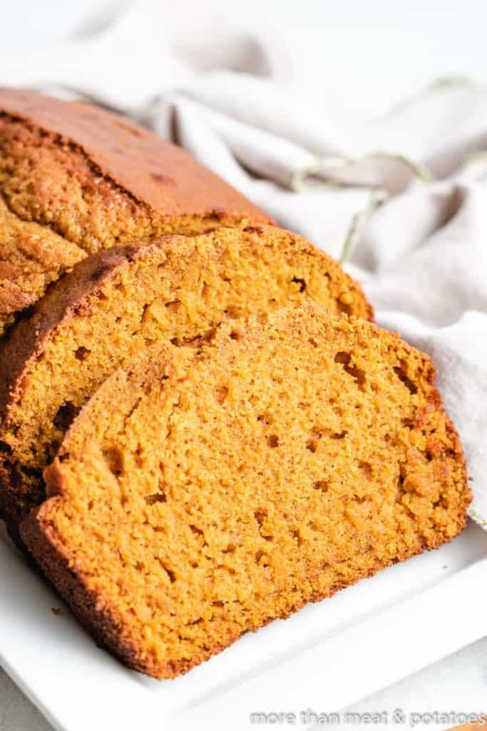 A close-up view of sliced sourdough pumpkin bread.