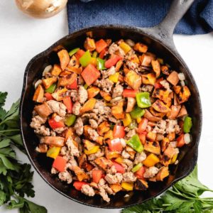 An aerial view of the sweet potato hash in a skillet.