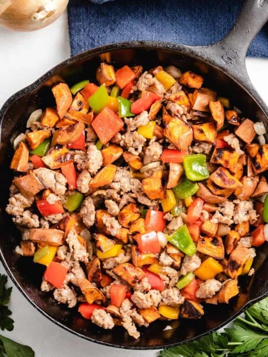 An aerial view of the sweet potato hash in a skillet.