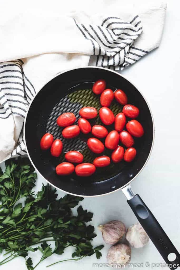 Fresh tomatoes and oil in the pan.