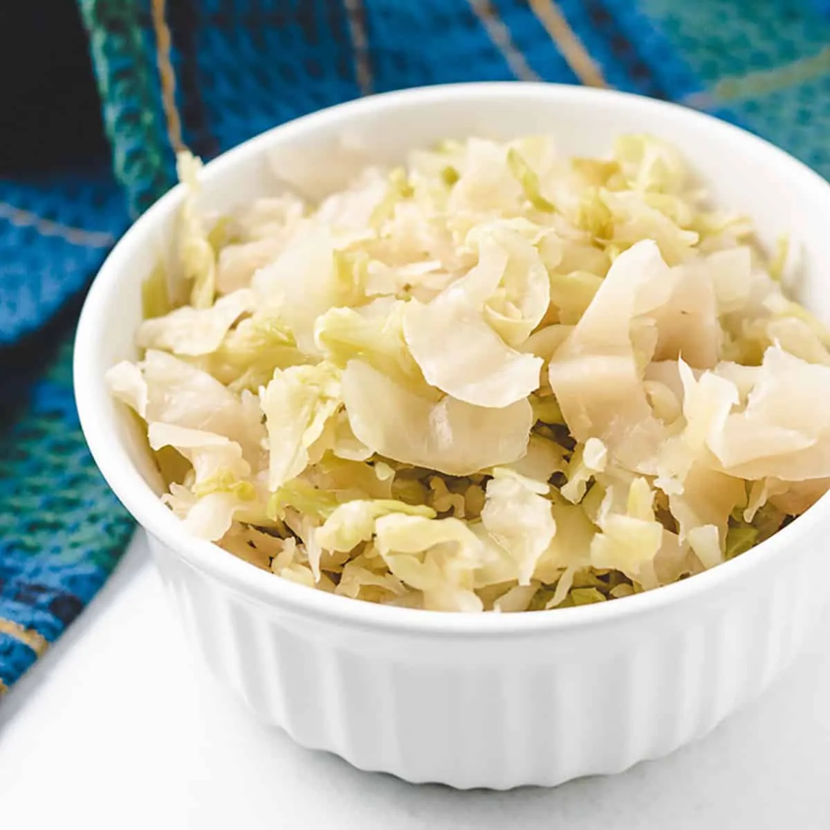 A small ramekin filed with the raw sauerkraut.