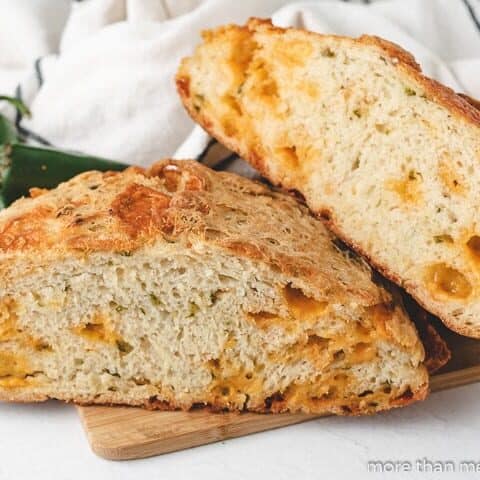 Jalapeno Cheddar Bread A sliced and stacked loaf of jalapeno cheese bread.