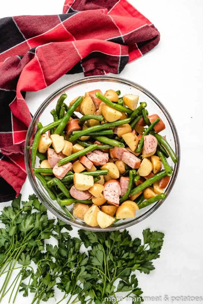 The meat and veggies tossed with oil and spices.