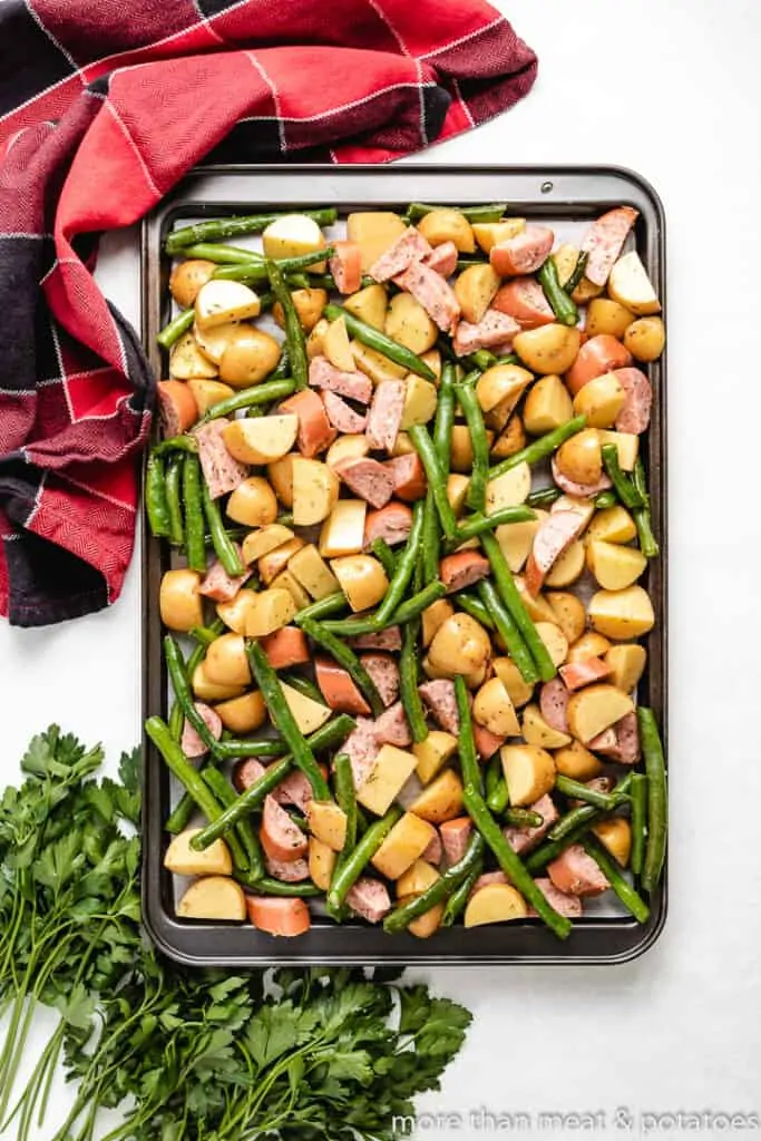 The ingredients spread evenly on a sheet pan.