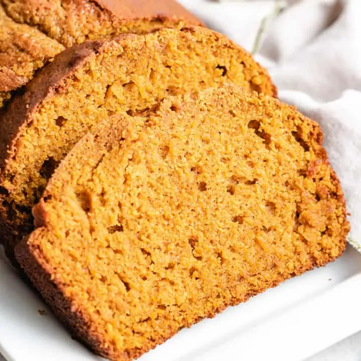 Sliced sourdough pumpkin bread on a plate.