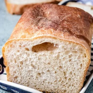 Fresh baked bread on a decorative plate.