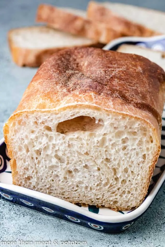 Fresh baked bread on a decorative plate.