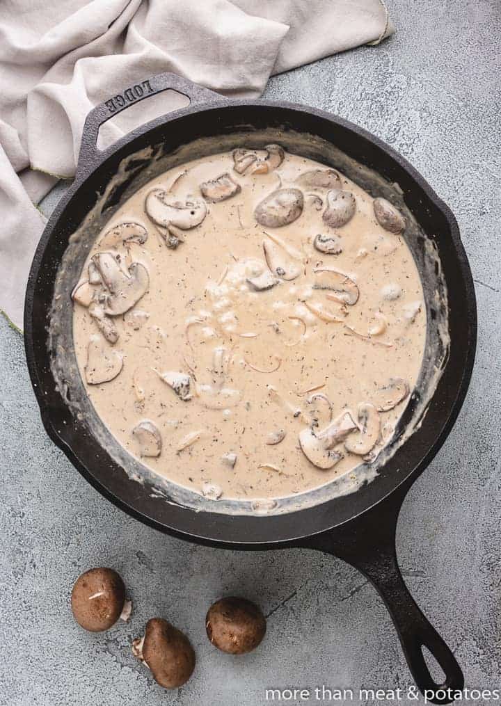 Mushroom gravy simmering in the skillet.