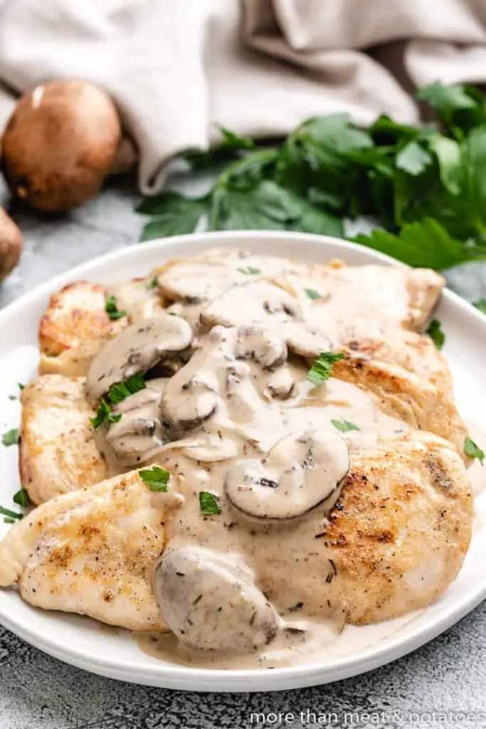 The finished mushroom chicken dish on a plate.