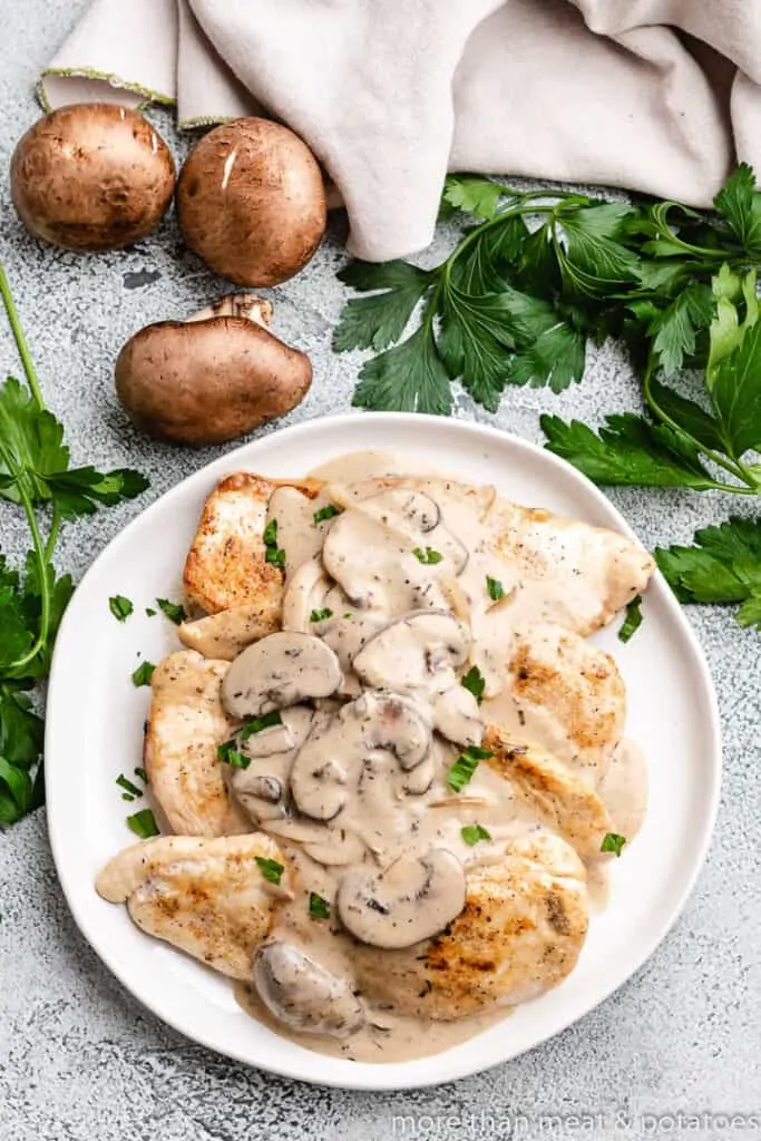 The creamy chicken dish garnished with fresh parsley.