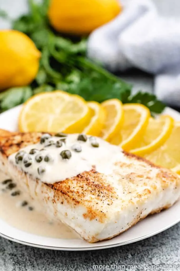 A lemon sauce served over cooked fish.