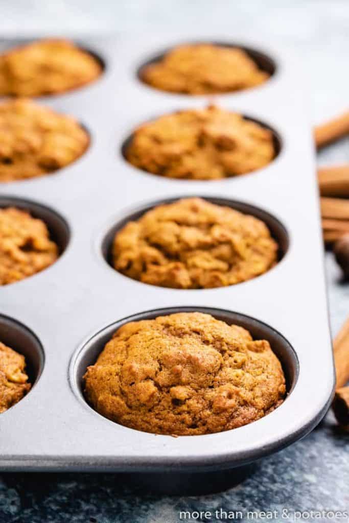 The baked muffins cooling in the muffin tin.