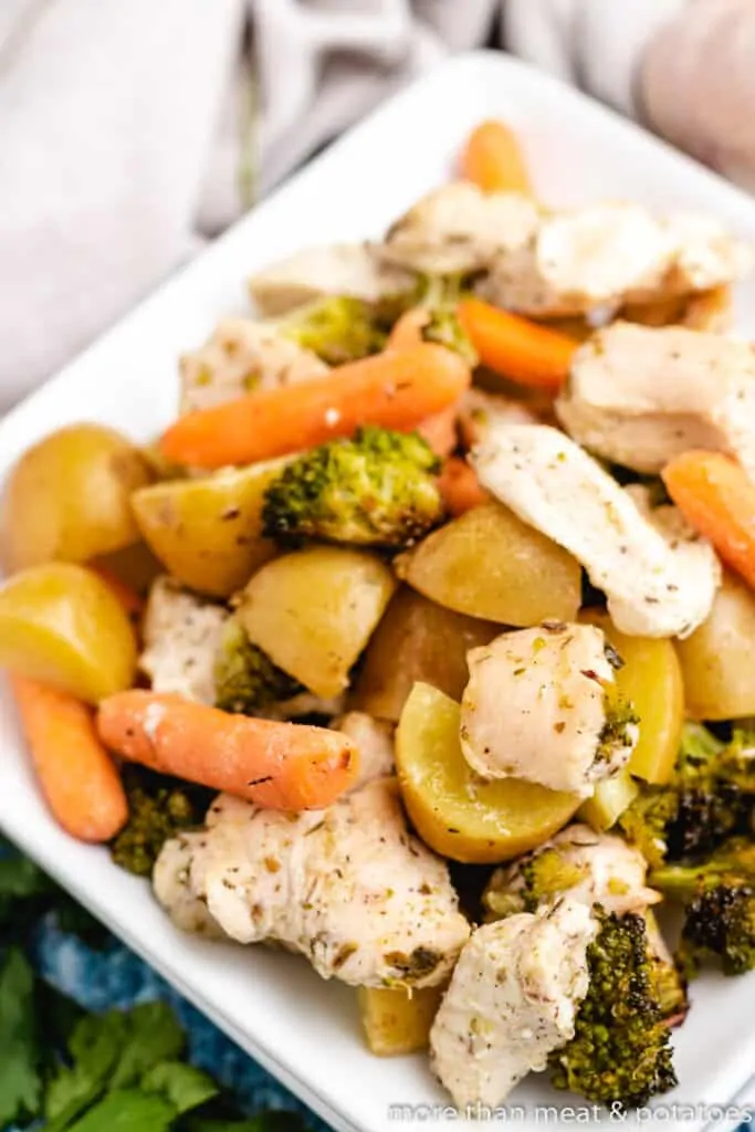 An up-close view of meat and veggies on a plate.