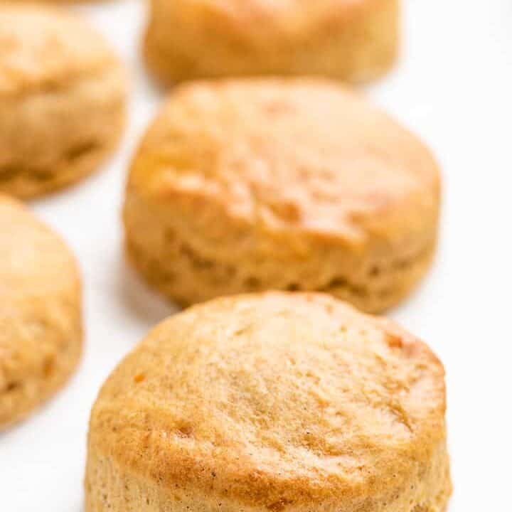A close-up of the baked biscuits on a sheet pan.