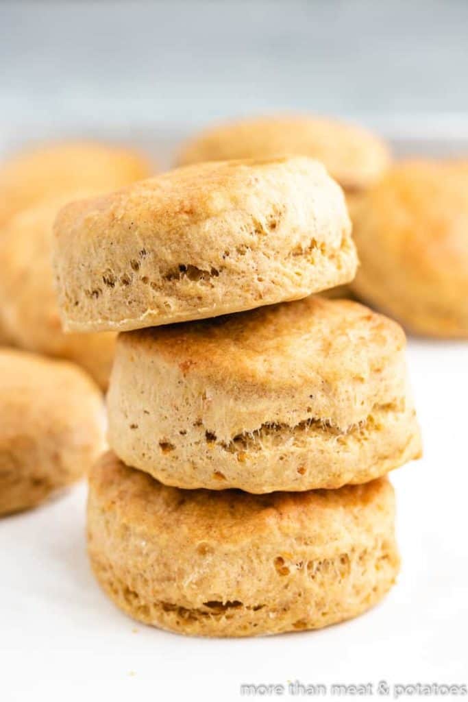 Three baked biscuits stacked on top of each other.