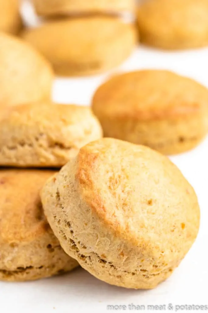 The fresh baked potato biscuits on a counter.