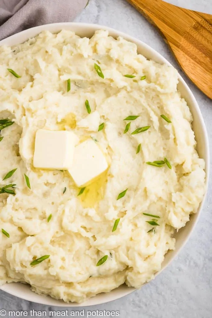 Top-down view of butter melting on the taters.