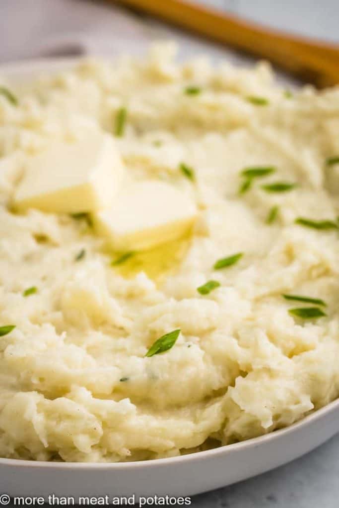 An up-close view of the butter and seasoned potatoes.