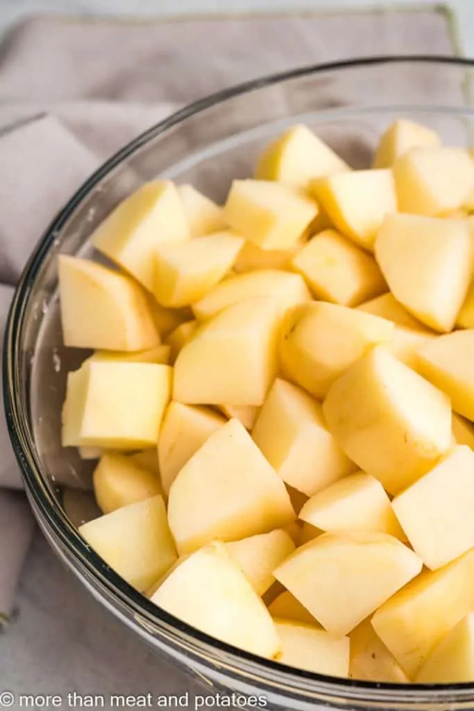 The potatoes have been diced in the bowl.