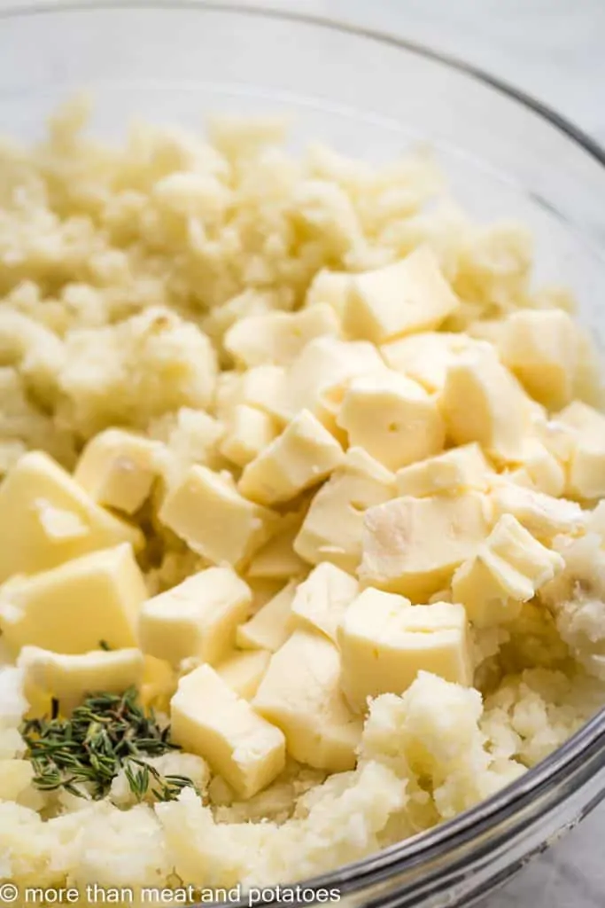 Butter, cream, and spices added to the potatoes.