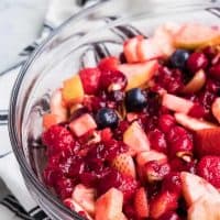 Berries, nuts, and remaining fruit added to the bowl.