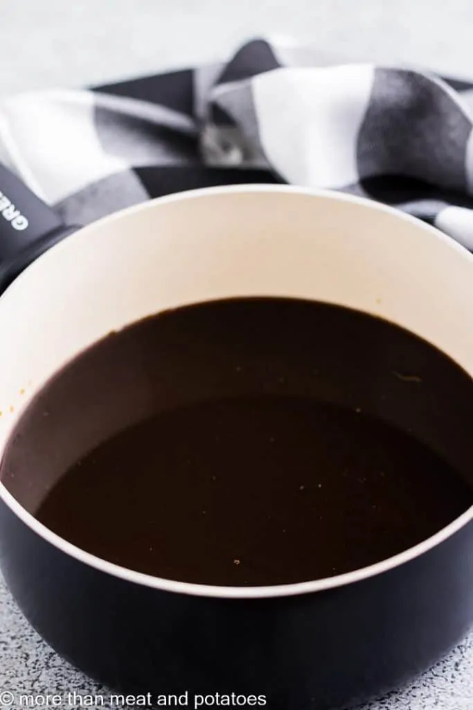 Coffee and dark chocolate mixed in a saucepan.