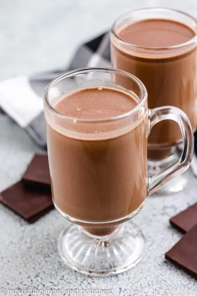 Two after-dinner drinks served in glass mugs.