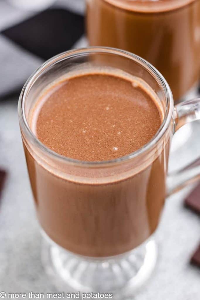 An up-close view of chocolate coffee in a mug.