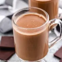 A mug filled with rich, dark chocolate coffee.