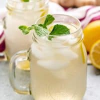 The finished drink served with lemon and mint.