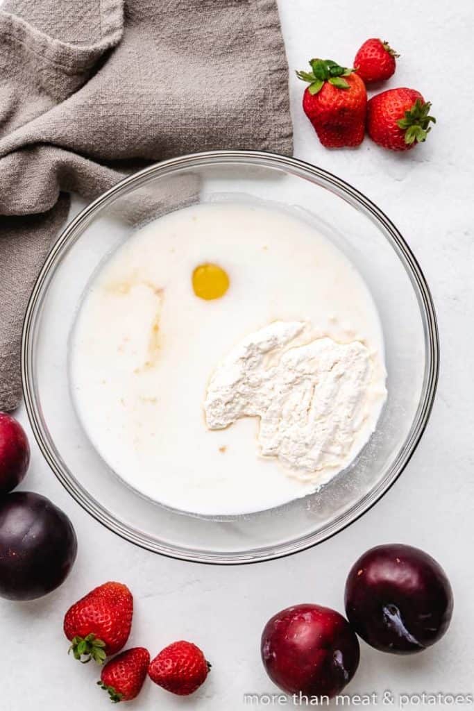 Flour, egg, and other ingredients in a mixing bowl.