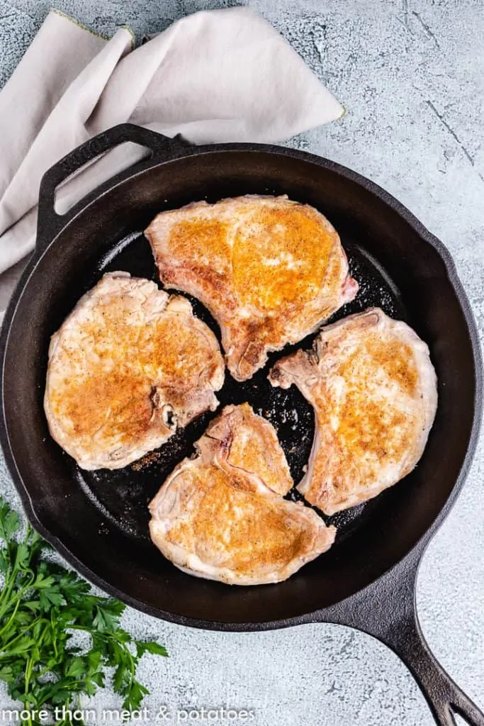 The pork transferred to the hot pan.