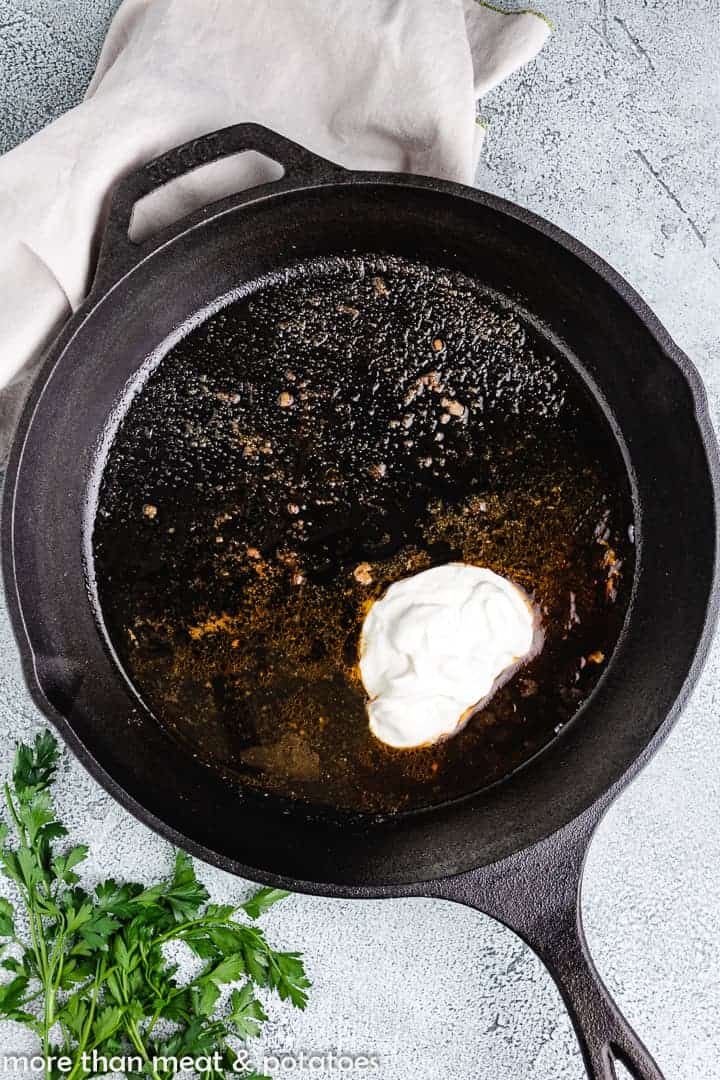 Sour cream and paprika added to the pan.